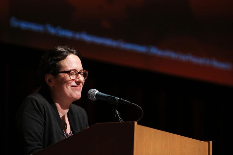NYT journalist Maggie Haberman speaks at a podium.